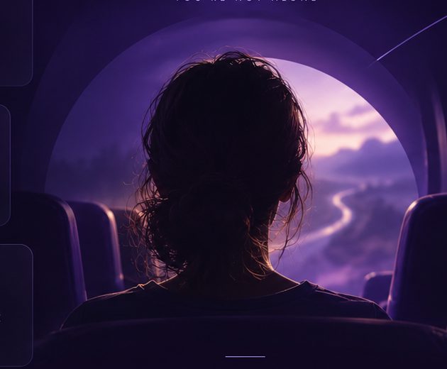 Passenger looking through a bus window toward a winding road